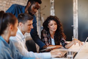 Group of Web Designers at Computer